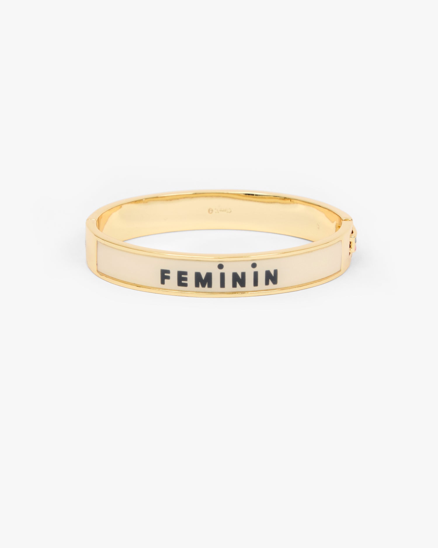 Le Bangle Bracelet showing the other side of the bracelet that reads  inchFEMININ inch. 